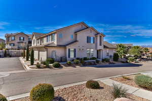 Front of property featuring a garage and central AC unit