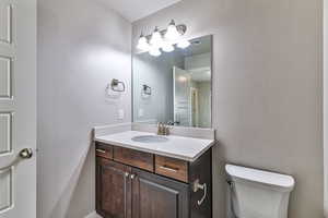 Bathroom featuring toilet and vanity