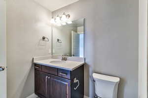 Bathroom with vanity and toilet