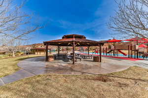 View of property's community featuring a playground and a lawn