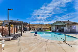 View of swimming pool with a patio, a pergola, and a mountain view