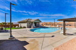 View of pool with a pergola, a mountain view, and a patio area