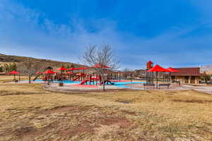 View of play area featuring a lawn