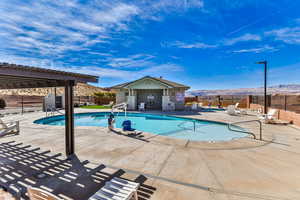 View of swimming pool featuring a mountain view and a patio