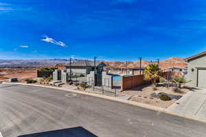 View of front of property featuring a mountain view and a garage