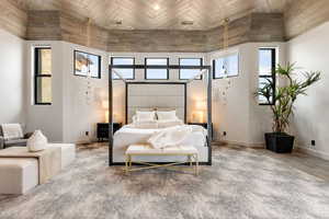 Bedroom featuring wood-type flooring, wood ceiling, and a towering ceiling