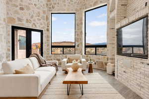 Living room featuring a mountain view and light hardwood / wood-style flooring