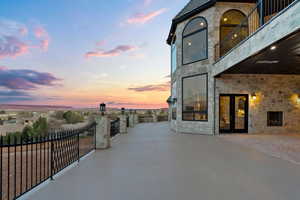 Patio terrace at dusk with french doors