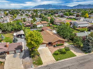 Aerial view of residential area featuring a mountain backdrop