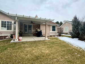 Rear view of house featuring a patio area, a yard, and ceiling fan