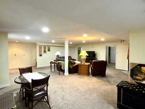 Living room with carpet and a textured ceiling