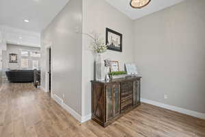 Hallway featuring light wood-type flooring