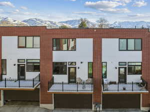 Back of house featuring a mountain view