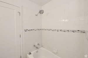 Bathroom featuring tiled shower / bath