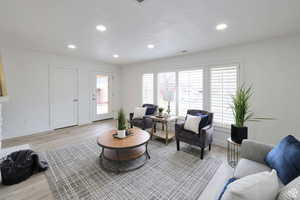 Living room with light wood-type flooring