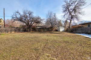 View of yard featuring a storage unit