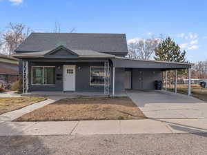 View of front of house featuring a carport