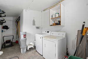 Laundry room featuring independent washer and dryer