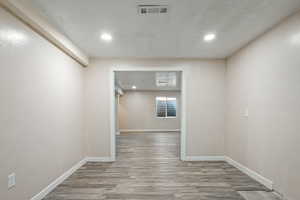 Unfurnished room with light wood-type flooring