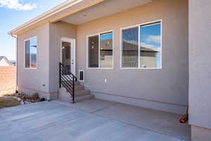 Property entrance featuring a patio area