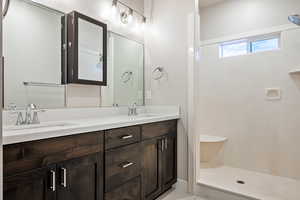 Bathroom featuring vanity and walk in shower
