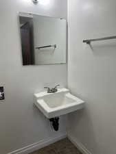 Unit 1 Bathroom with tile patterned floors and sink