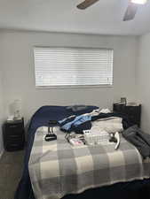 Unit 1 Carpeted bedroom with ceiling fan