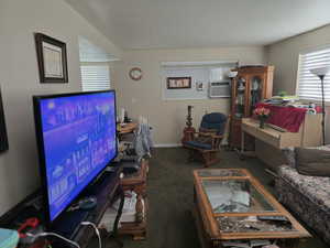 Unit 2 Carpeted living room featuring a textured ceiling