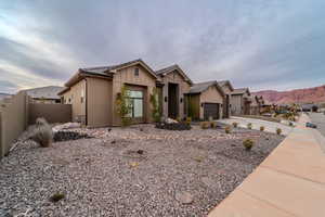 View of front of home featuring a mountain view and a garage