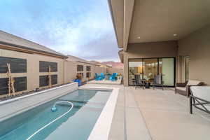 View of pool featuring a patio area and a mountain view