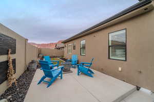 View of patio / terrace with a mountain view and an outdoor fire pit