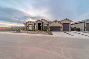 View of front facade featuring a mountain view and a garage