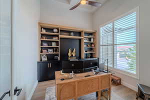 Office area featuring light wood-type flooring and ceiling fan