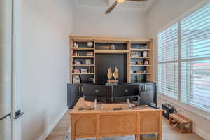 Office area with ceiling fan, a wealth of natural light, and wood-type flooring