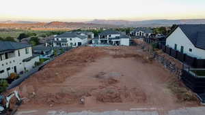 Aerial view at dusk featuring a mountain view