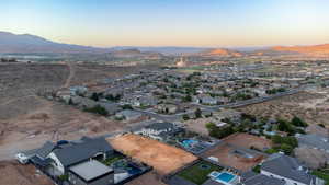 Aerial view at dusk featuring a mountain view