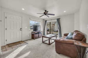 Living room featuring ceiling fan