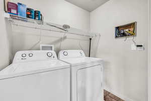 Laundry area with washer and clothes dryer