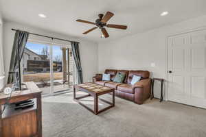 Living room has sliding glass door with access to patio