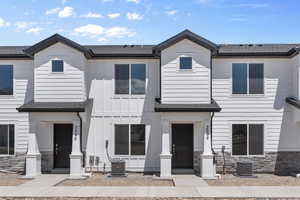 View of front of home featuring central air condition unit