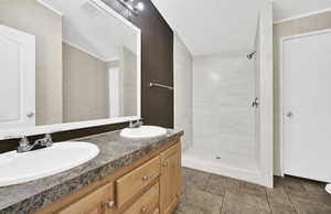 Bathroom with vanity and a shower