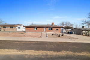 Ranch-style house featuring a carport