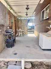 View of patio / terrace featuring ceiling fan and a grill