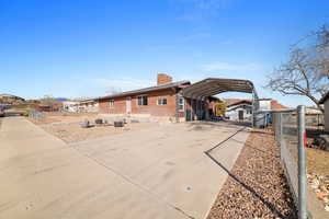 Back of property featuring a carport