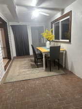 Dining room featuring a textured ceiling and ceiling fan