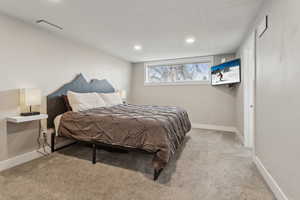 Bedroom with light carpet