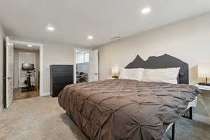 Carpeted bedroom with a textured ceiling