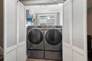 Laundry area with washer and clothes dryer