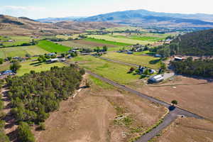 Drone / aerial view with a mountain view and a rural view