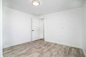 Empty room with light wood-type flooring